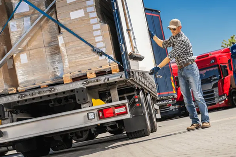cargo driver securing his truck to prevent cargo theft